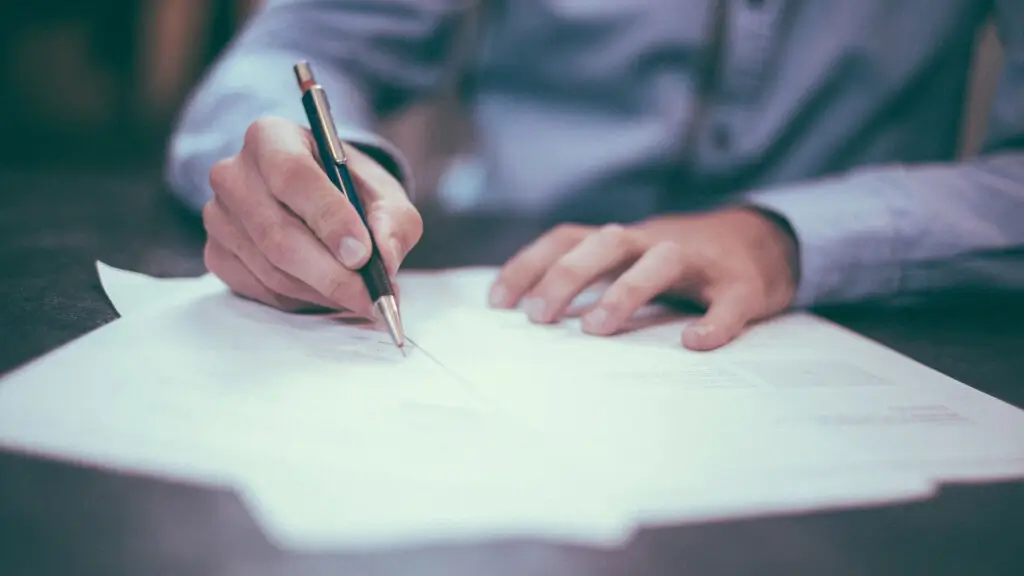 Quantity Surveyors Christchurch professional reviewing and signing documents